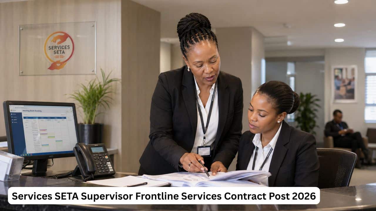 South African frontline services supervisor guiding reception staff in a professional office environment.